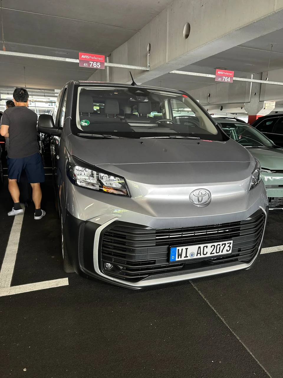 Gray Toyota rental van waiting in the Munich Airport garage
