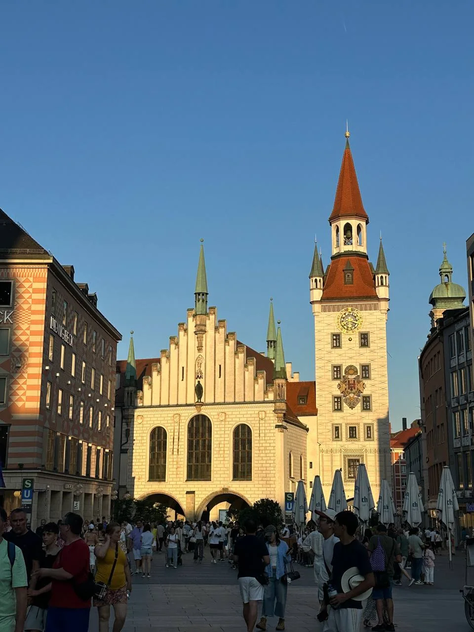 Sunlit historic facades and church towers in Munich old town