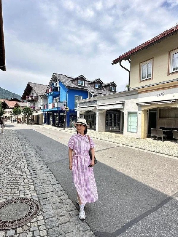 Traveler walking along a quiet street in Oberammergau
