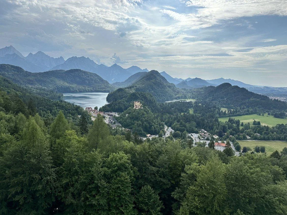 Alpsee and layers of Bavarian mountains seen from above