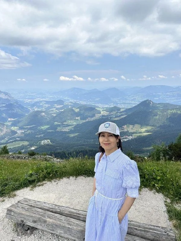 Traveler overlooking mountain ridges from Kehlsteinhaus