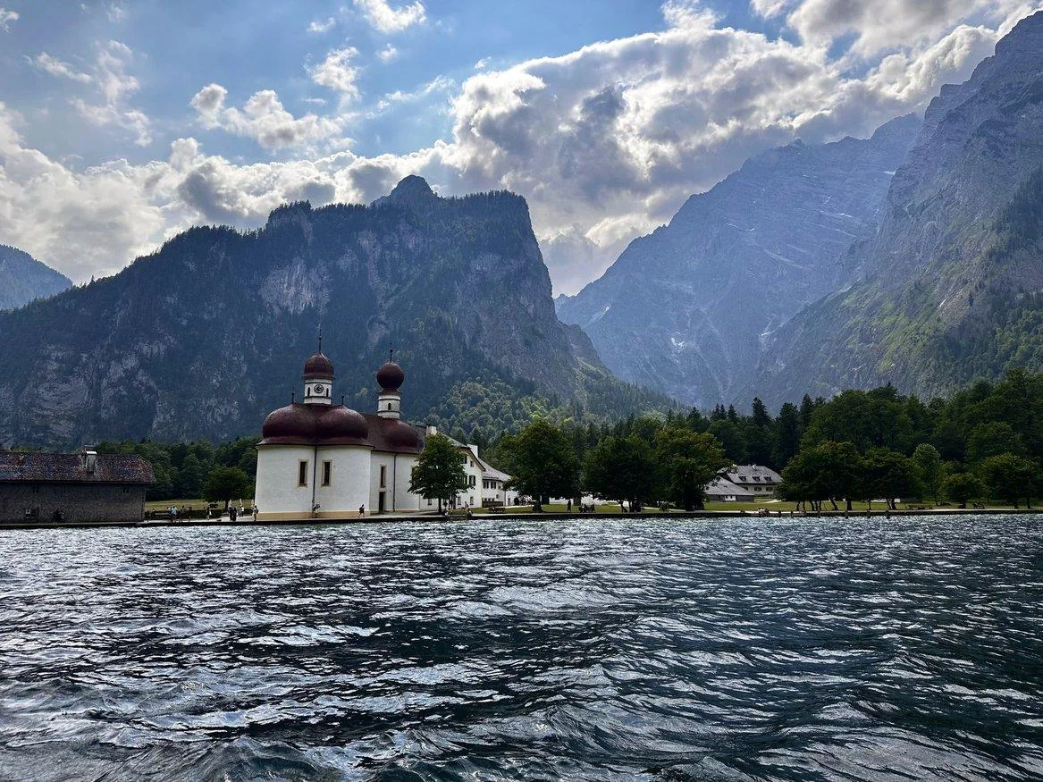 St. Bartholomä church beneath dramatic mountains at Königssee