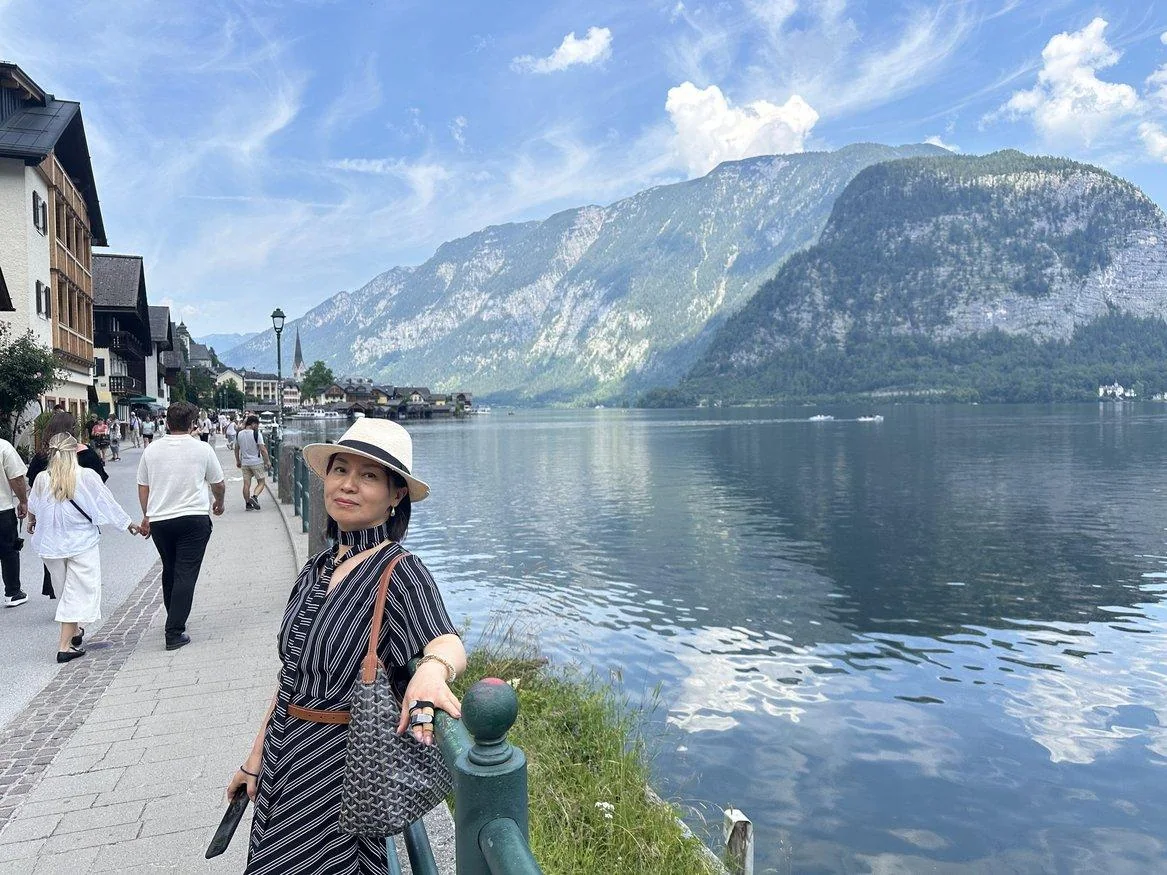 Hallstatt waterfront reflected in calm blue water
