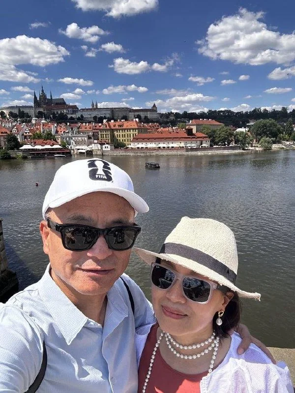 Couple taking a selfie above the Vltava River