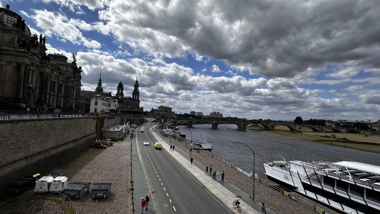 Dresden baroque skyline and the Elbe River beneath dramatic clouds
