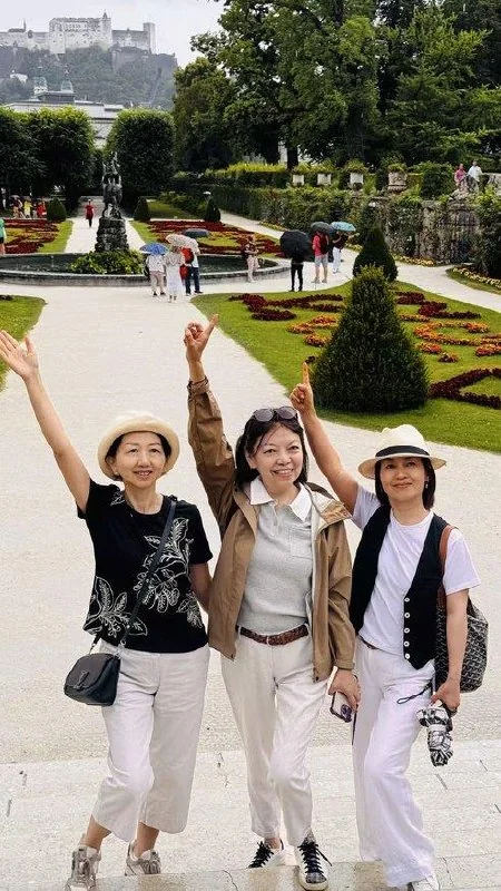 Three friends celebrating together in a Dublin garden