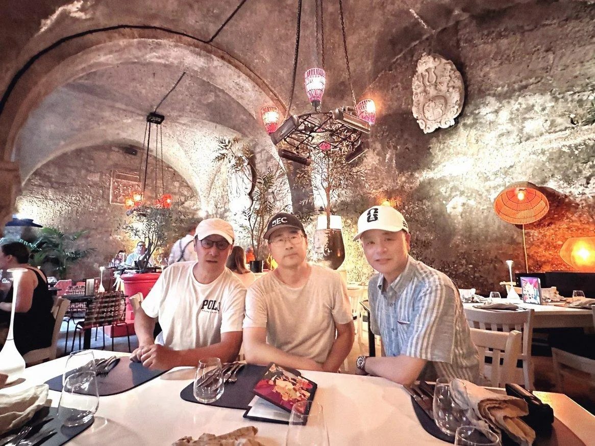 Friends sharing a farewell meal in a vaulted Dublin restaurant
